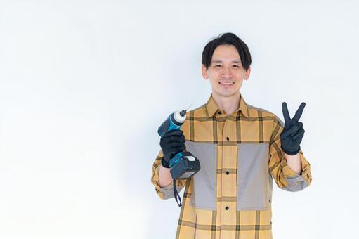 電動ドリルを持つDIY作業員 diy,職人,作業員の写真素材