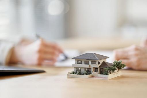 Business person having a real estate meeting, building model, house, detached house, JPG