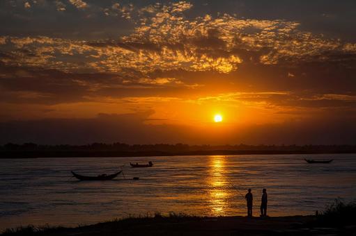 The two of them against the backdrop of the orange sparkling water surface, sunset, setting sun, sunset, JPG