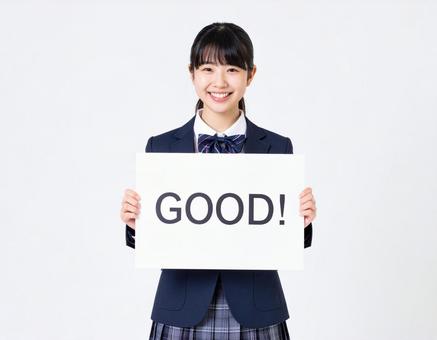 GOODと書いたボードをもつ生徒 GOODと書いたボードをもつ生徒の写真