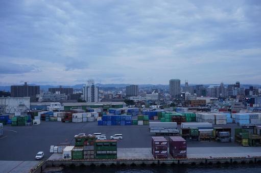 Port town and container yard at dusk, JPG