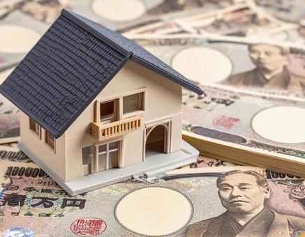 住宅模型とお金の写真 住宅模型とお金の写真の写真
