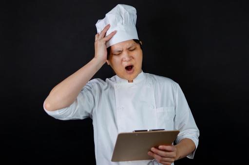 悩むシェフの表情 悩むシェフの表情 シェフ,料理人,調理師の写真素材