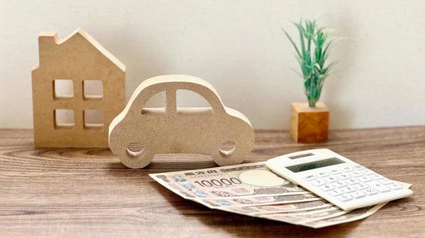 車と家の小物とお金と計算機_白背景 車と家の小物とお金と計算機_白背景の写真