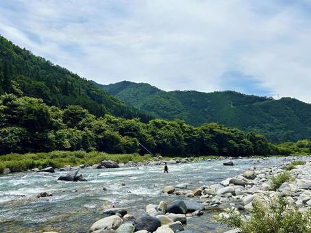 川釣りをする人々 川釣りをする人々 空,川釣り,川の写真素材