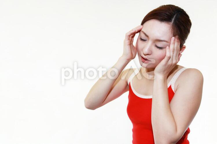頭痛を訴える女性 頭痛,女性,女の写真素材