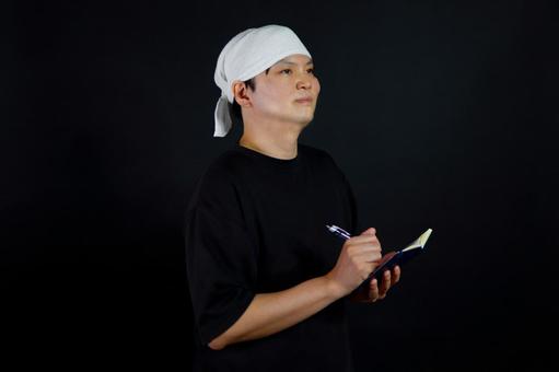 メモを取る男性 メモを取る男性の写真