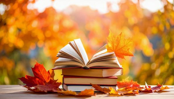 読書の秋 机の上の本 落ち葉の紅葉 読書の秋 机の上の本 落ち葉の紅葉の写真
