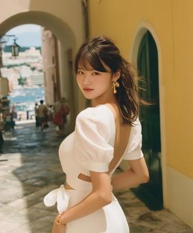 ドレスを着た女性がヨーロッパの街を散歩中 ドレスを着た女性がヨーロッパの街を散歩中の写真