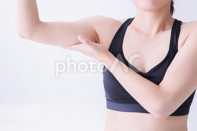 二の腕をつかむ女性 二の腕,触る,脂肪の写真素材