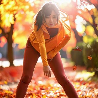 スポーツの秋 紅葉の中でストレッチ 女性 スポーツの秋 紅葉の中でストレッチ 女性の写真