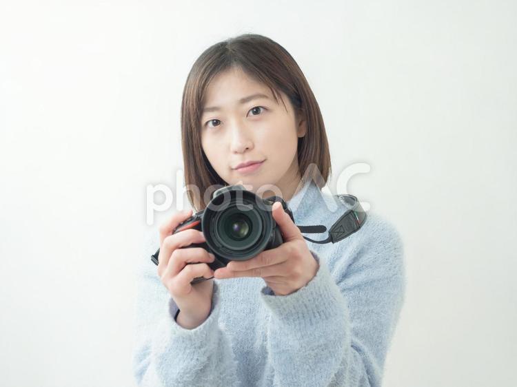 一眼レフと女性のイメージ カメラ女子,カメラマン,一眼の写真素材
