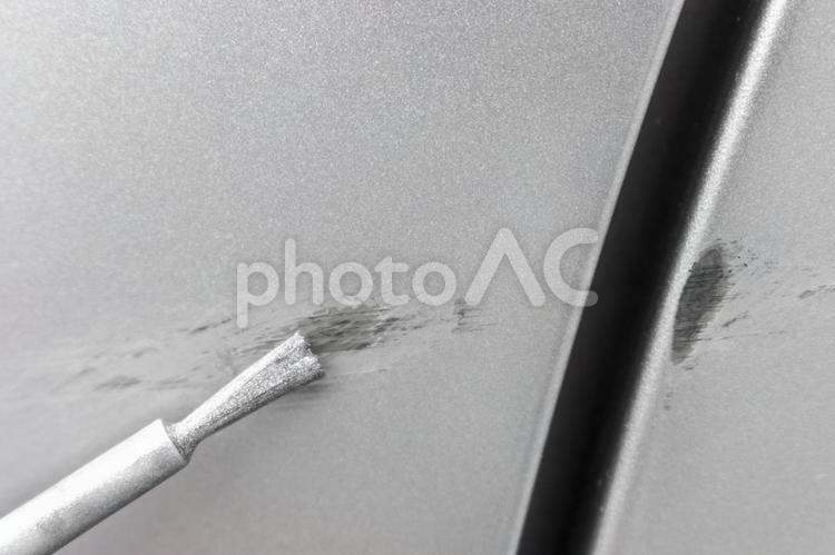 車体に付いた傷跡とタッチペン 自動車,車,事故の写真素材