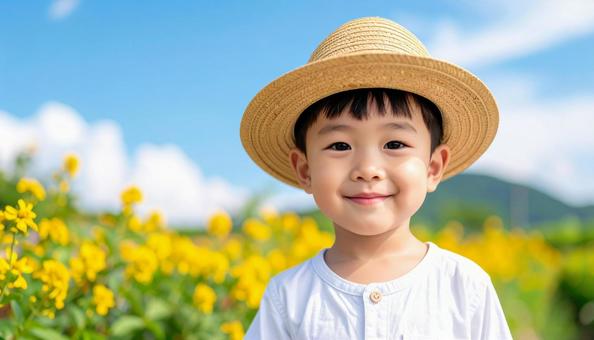 ヒマワリを背景にした少年のポートレートの写真