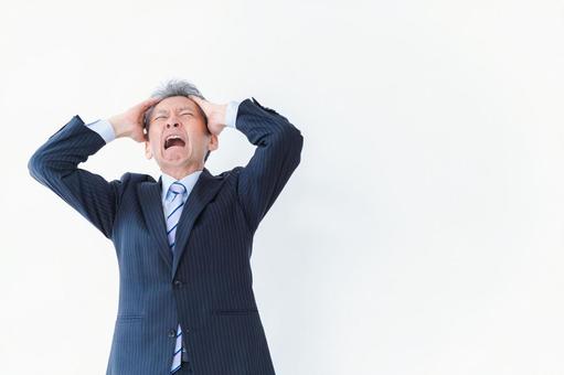 頭を抱える経営者 働く,中高年,経営者の写真素材