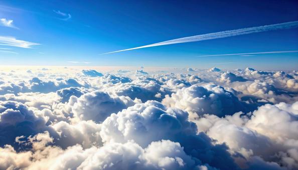 飛行機雲と青空の写真