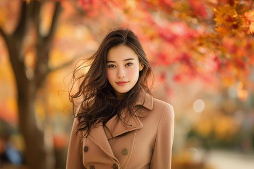 秋色に包まれた女性のポートレートの写真