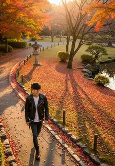 秋の庭園を散策する革ジャン姿の男性 秋の庭園を散策する革ジャン姿の男性の写真