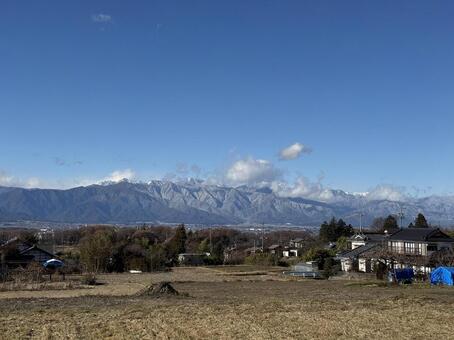 長野県塩尻市片丘から見た北アルプス方面 冬,塩尻市,風景の写真素材