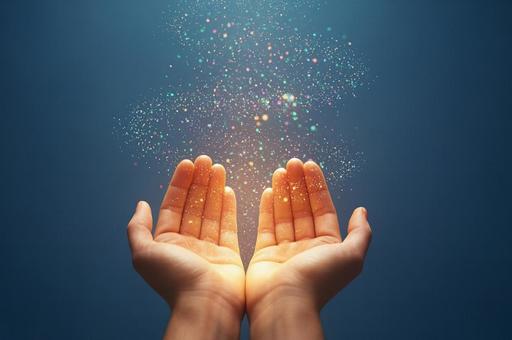 両手に舞う光ときらめきの幻想の写真