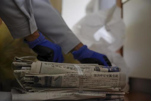 Hands of a man sorting recyclable waste, resource garbage, newspaper, ancient news, JPG