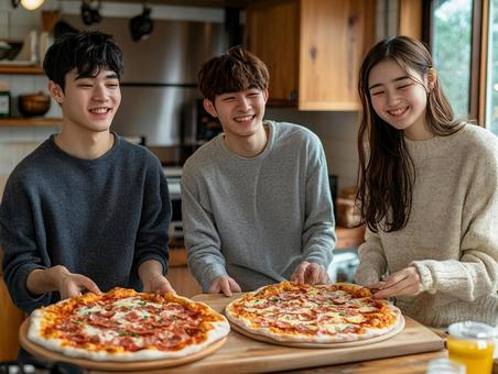 ピザパーティをする若者達 ピザパーティをする若者達の写真
