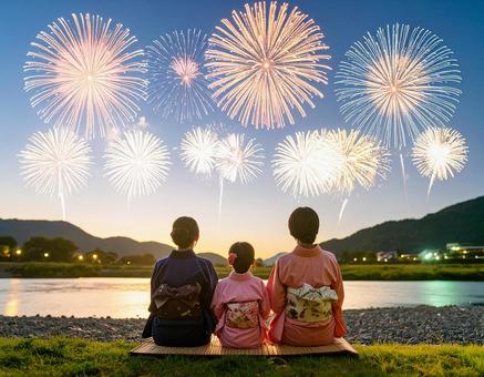 夕暮れに家族で花火鑑賞 夕暮れに家族で花火鑑賞の写真