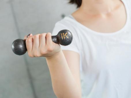 Japanese woman doing dumbbell training at home Japanese woman doing dumbbell training at home