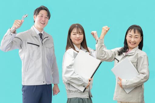 ガッツポーズする作業員チーム 作業員,作業服,職人の写真素材