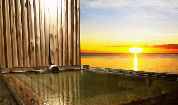Open-air bath with a view of the setting sun Open-air bath with a view of the setting sun