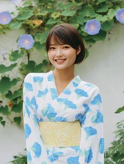 朝顔を背景に朝顔柄の浴衣を着た女性 朝顔を背景に朝顔柄の浴衣を着た女性の写真