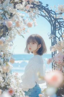 海をバックに立つ女性のポートレート 海をバックに立つ女性のポートレートの写真