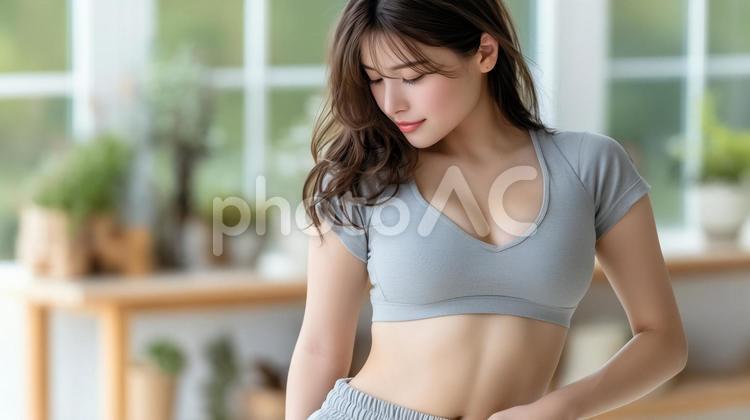 ウエスト確認する女性 ウエストチェック,ダイエット,健康管理の写真素材