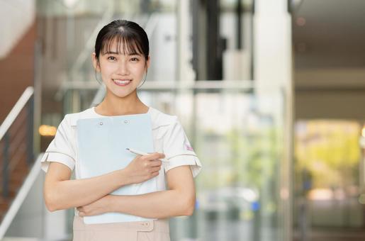 クリニックで働く若い女性 クリニック,病院,受付の写真素材