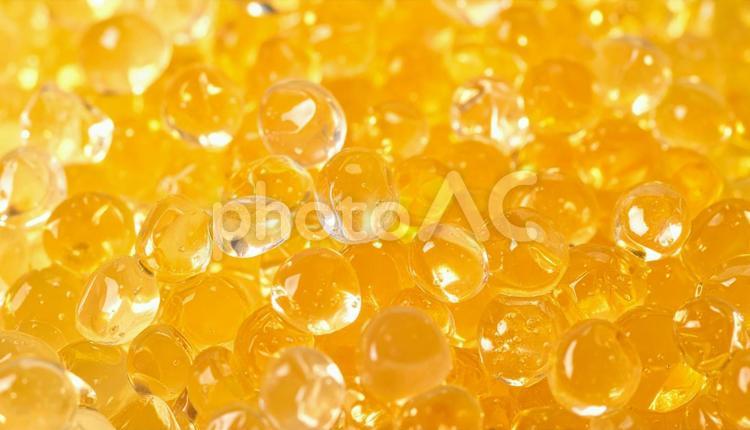 透明オレンジ色のゼリーのようなテクスチャ 背景,バックグラウンド,テクスチャの写真素材
