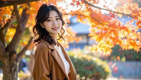 秋の背景に立つ若い日本人女性 秋の背景に立つ若い日本人女性の写真