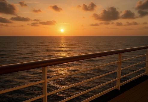 クルーズ船のデッキから眺める夕焼け クルーズ船のデッキから眺める夕焼けの写真