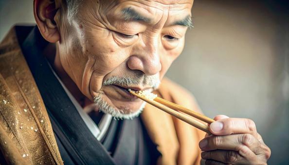 精進料理を食べる老いた僧侶 精進料理を食べる老いた僧侶の写真