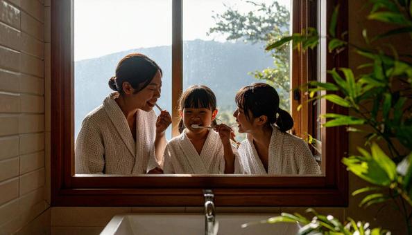 歯磨きする家族 歯磨きする家族の写真