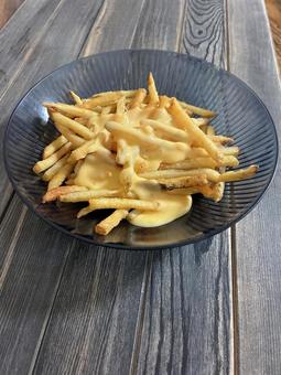 フライドポテトのチーズかけ フライドポテトのチーズかけ フライドポテト,ポテト,ポテトのチーズかけの写真素材