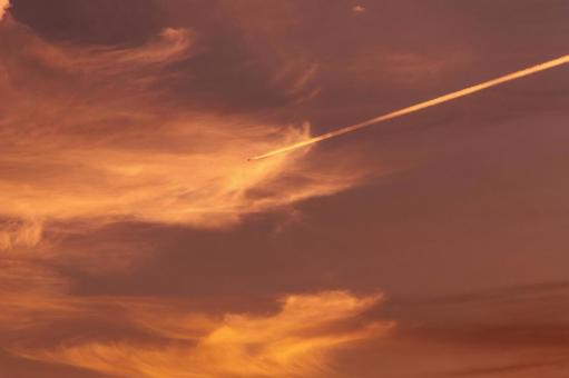 Sunset sky and airplane trails, JPG