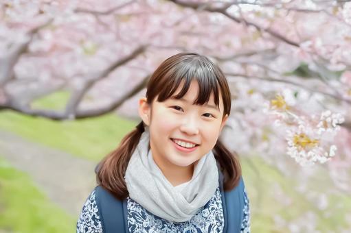 満開の桜と笑顔の少女 満開の桜と笑顔の少女の写真