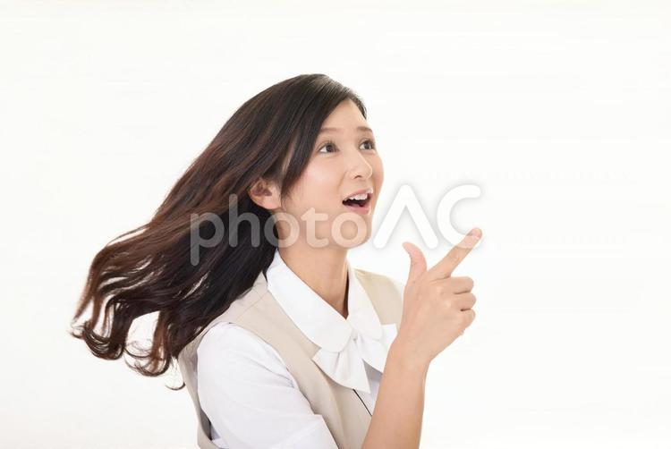 指示する笑顔のビジネスウーマン 女性,ビジネスウーマン,女の写真素材
