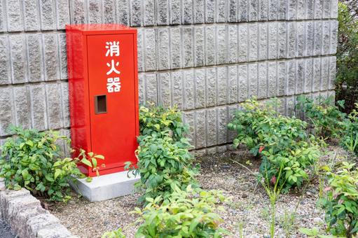 屋外の赤い消火器ボックス 消火器,防災,安全の写真素材