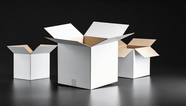 白いダンボール　黒い背景の写真