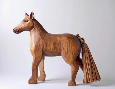 木製の馬の置物　干支　午　白背景の写真