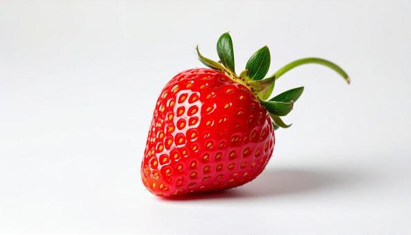 白い背景にへた付きのイチゴの写真