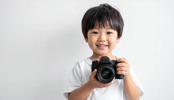 子供とカメラ、コピースペースの写真