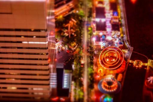 夜の遊園地と海 夜の遊園地と海 夜景,遊園地,海の写真素材