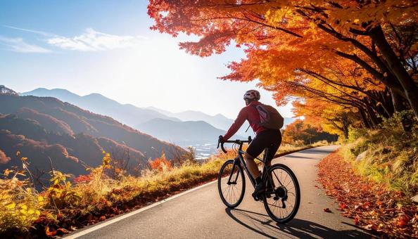 ロードバイクでサイクリングする男性 ロードバイクでサイクリングする男性の写真